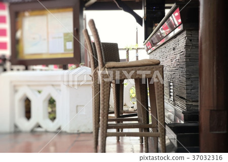 Chairs and counters by the pool 37032316