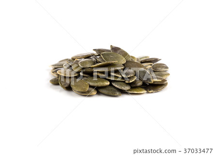 Pumpkin seeds on a white background Pumpkin seeds on a white background 37033477