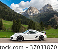 Luxury sports car against the backdrop of the northern Italian Alps 37033870