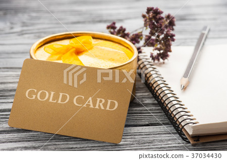 Gift golden card, notebook, candle and box 37034430