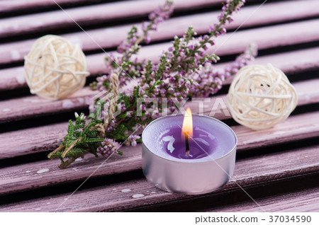 Pink heather, purple lit candle 37034590