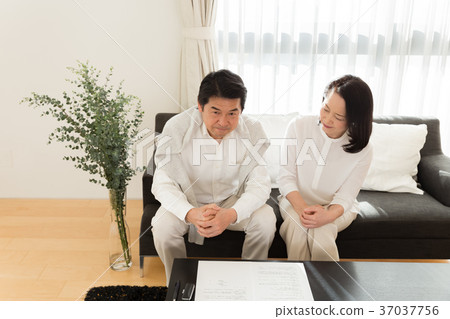 Senior couple discussing contract in front Senior couple discussing contract in front 37037756