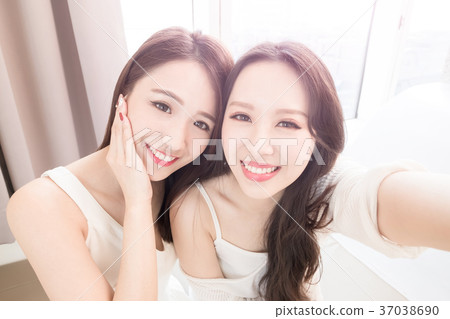 two beauty woman selfie happily two beauty woman selfie happily 37038690