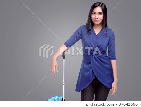 Pretty asian tourist woman with a suitcase Pretty asian tourist woman with a suitcase 37042560