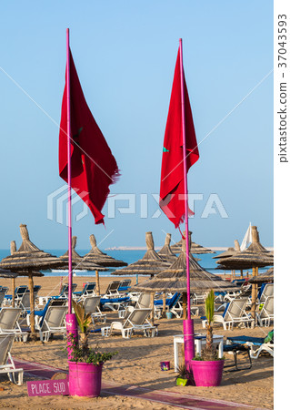 Beach loungers and umbrellas on the sea. Beach loungers and umbrellas on the sea. 37043593