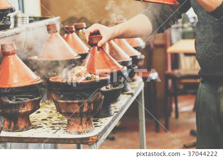 Cooking of meat in traditional Moroccan tajine 37044222
