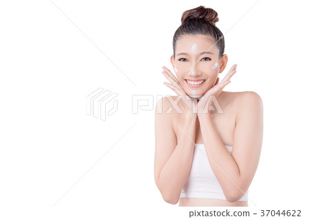 woman with cream on face smiling over white woman with cream on face smiling over white 37044622