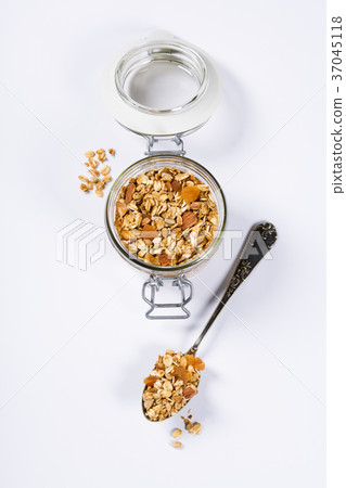 Homemade oatmeal granola with fruits and nuts Homemade oatmeal granola with fruits and nuts 37045118
