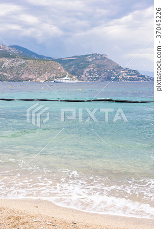Daylight cloudy day view to beachline with ships 37045226