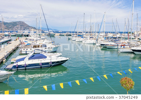 Daylight sunny view to parked yachts in port 37045249