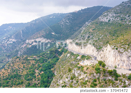 Daylight foggy view to Eze village, trees 37045472