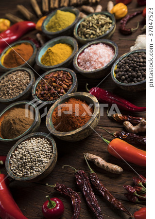 Spices on wooden bowl background 37047523