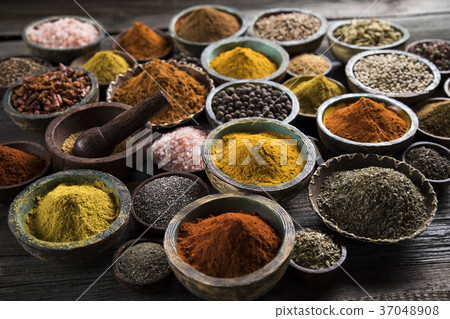Spices on wooden bowl background 37048908