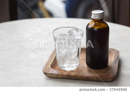Coffee cold brew in brown bottle Coffee cold brew in brown bottle 37048998