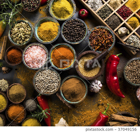Spices on wooden bowl background 37049156