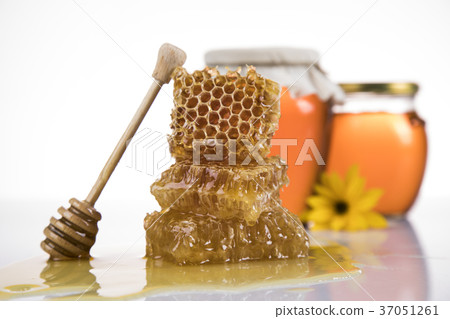 Jar of liquid honey Jar of liquid honey 37051261