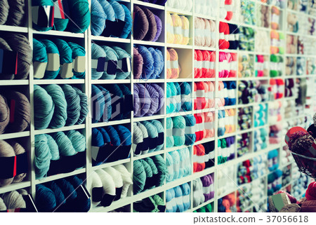 Shelves with various knitting yarn is staying 37056618