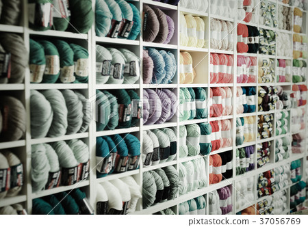 Variegated yarns for knitting on shop shelf Variegated yarns for knitting on shop shelf 37056769