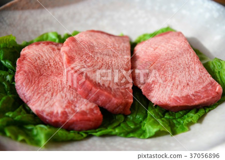 Thick cut raw beef tongue 37056896