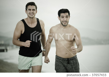 Two friends are jogging in time training 37057433