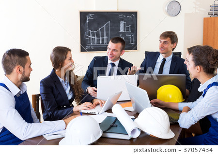 Architectural engineers discussing business project Architectural engineers discussing business project 37057434
