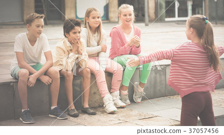 boys and girls are communicating outdoor boys and girls are communicating outdoor 37057456