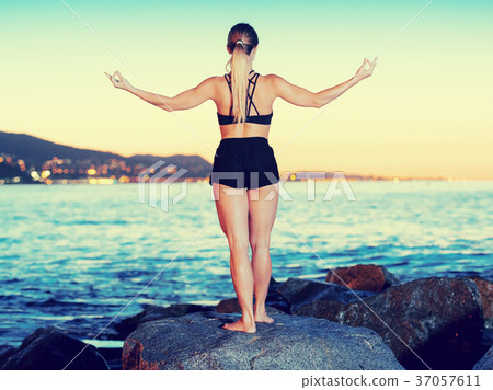 Female 24-31 years old is practicing stretching 37057611