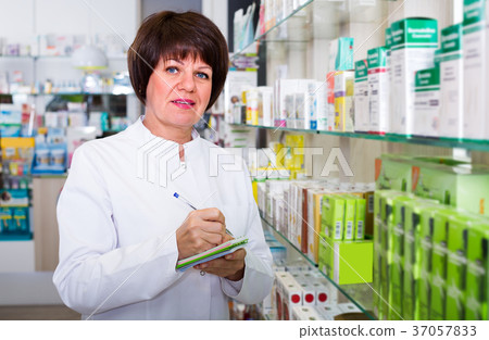 pharmacist working in shop 37057833