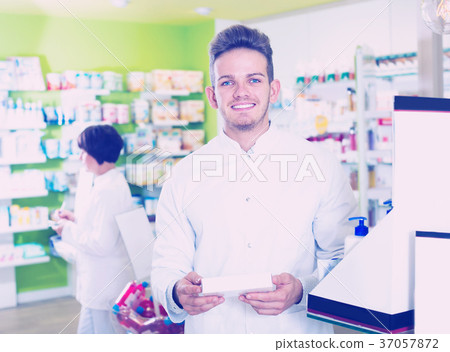 Portrait of two friendly positive pharmacists Portrait of two friendly positive pharmacists 37057872