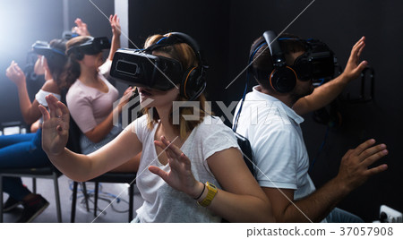 People wearing virtual reality goggles People wearing virtual reality goggles 37057908