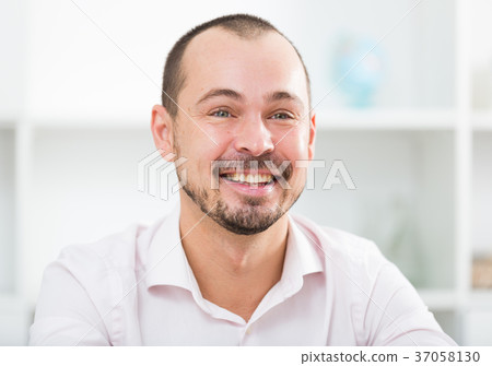 Positive young man in office 37058130