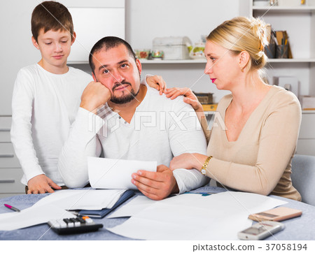 Family soothing chagrined man Family soothing chagrined man 37058194