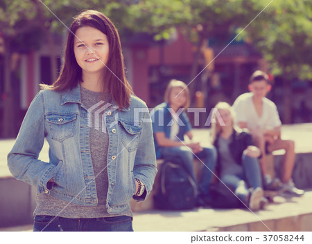 Cheerful girl smiling and standing 37058244