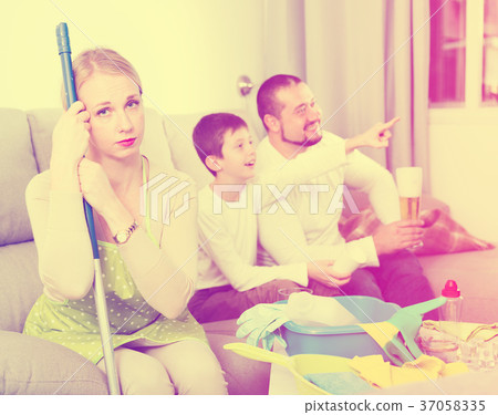 Tired woman with relaxing man with boy 37058335