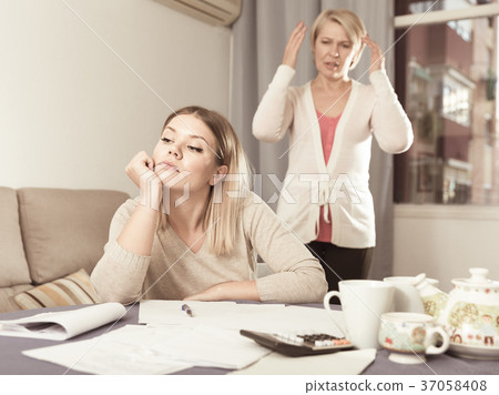 Mother scolds her adult daughter Mother scolds her adult daughter 37058408