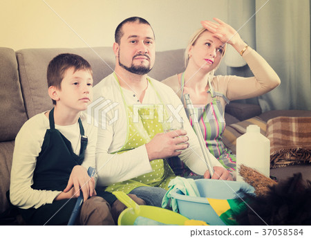 Tired family after home cleaning Tired family after home cleaning 37058584