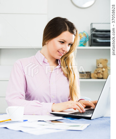 Female worker in office Female worker in office 37058628
