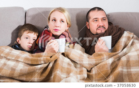 Ill family wrapping in blanket Ill family wrapping in blanket 37058630