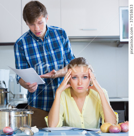 woman consulting with husband woman consulting with husband 37058633