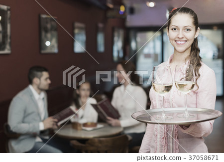 Waitress serving family of three Waitress serving family of three 37058671