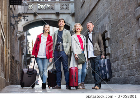 Portrait of young and mature couple with baggage Portrait of young and mature couple with baggage 37058801