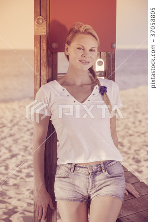 Happy sport woman is resting after training Happy sport woman is resting after training 37058805