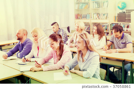 Professionals taking notes at training session 37058861