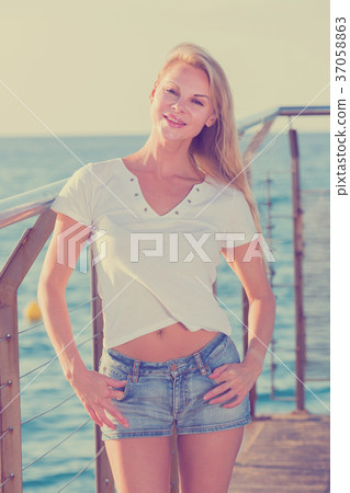Female is posing on pirce in her free time Female is posing on pirce in her free time 37058863