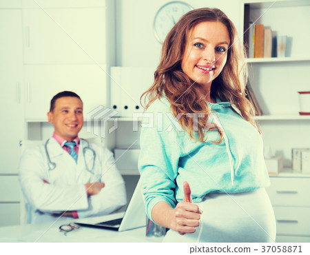 Doctor and pregnant visitor Doctor and pregnant visitor 37058871