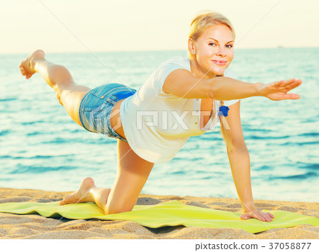 Portrait of sportswoman which is doing excercises on endurance Portrait of sportswoman which is doing excercises on endurance 37058877