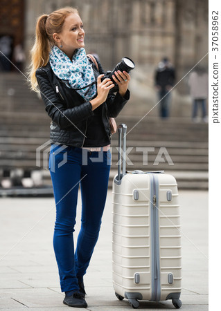 girl taking pictures of sights at city excursion 37058962
