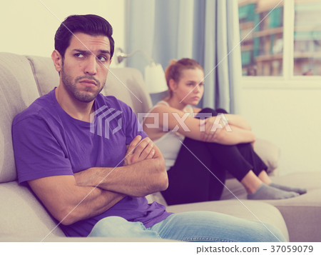 Man on sofa after quarrel with wife 37059079