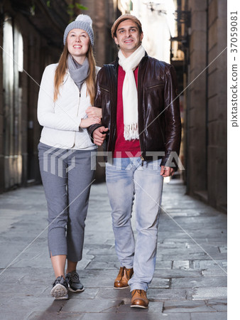 male and female walking in the historic center 37059081