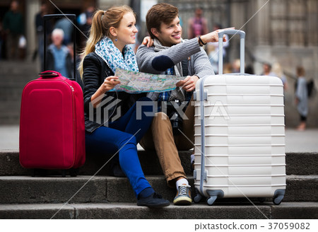 Young couple with a map 37059082